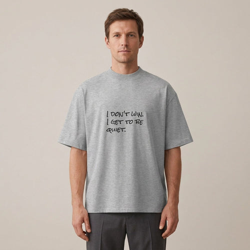 Man wearing the I Don't Win. I Get to Be Quiet. t-shirt in heather grey