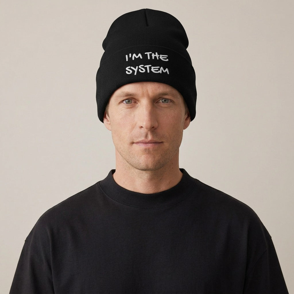 Model wearing the I'm the System embroidered beanie in black