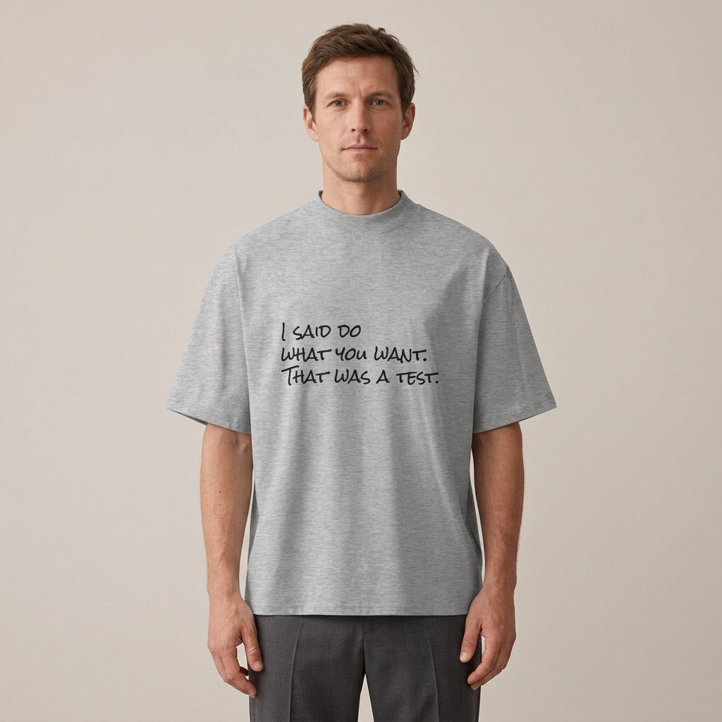 Model wearing the I Said Do What You Want. That Was a Test. t-shirt in heather grey