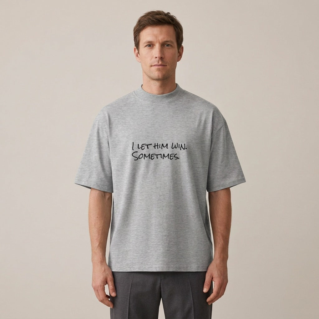 Model wearing the I Let Him Win. Sometimes. t-shirt in heather grey