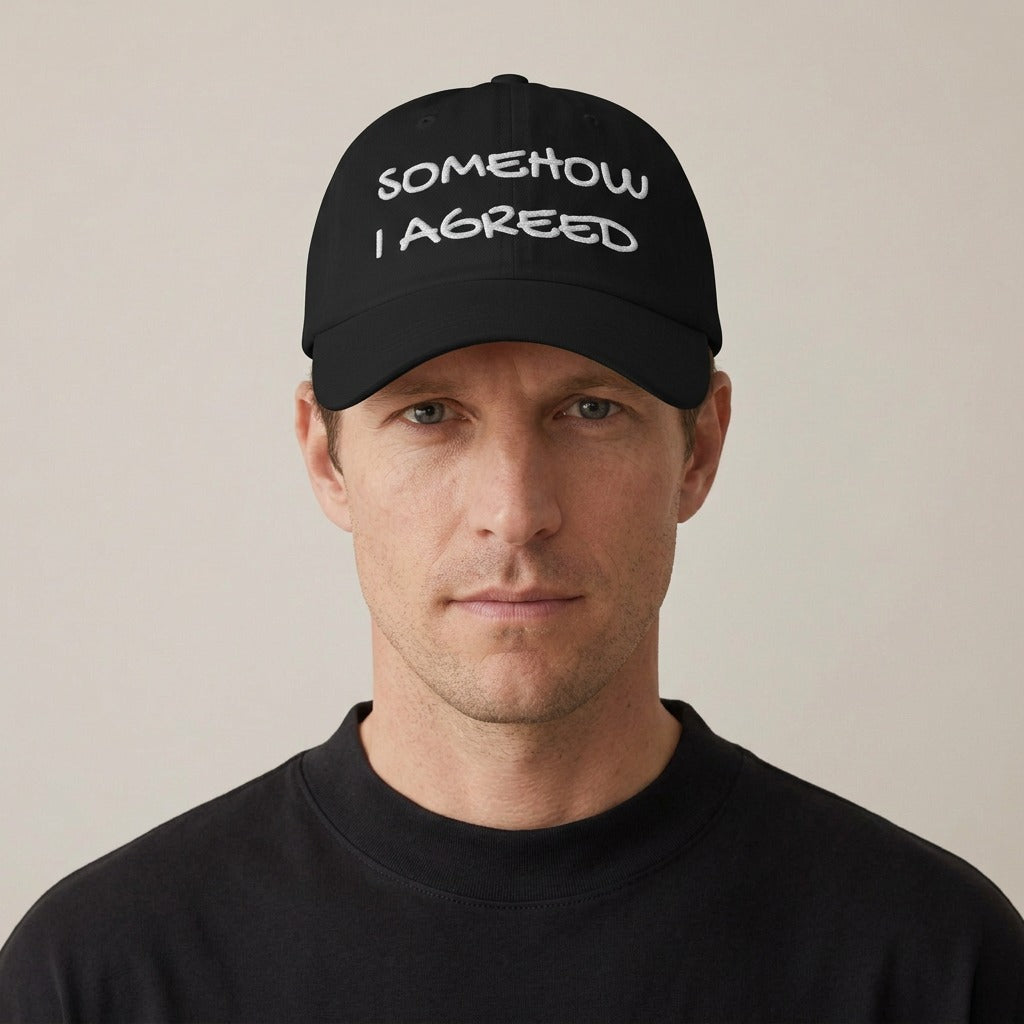 Man wearing the Somehow I Agreed embroidered dad hat in black